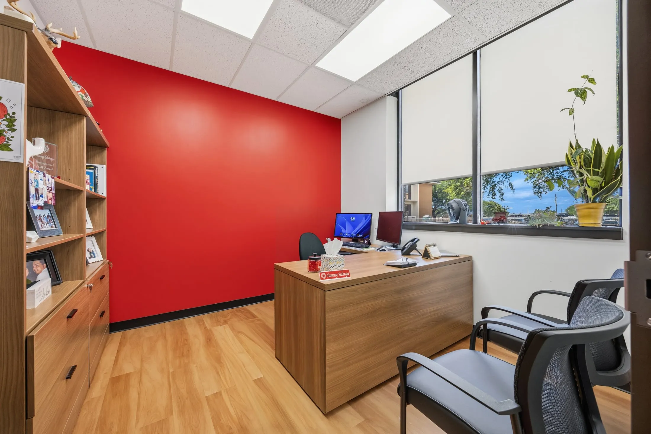 Private office with a red accent wall at the Lamar University Wimberly Registrar Office